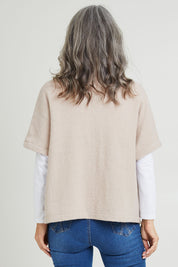Model Luisa wearing size S of the Button Thru Vest in colour Stone, from the front, cropped image