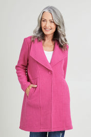 Model Luisa wearing size S of the 1 Button Collared Coat in colour Pink (Pink), from the front, cropped image