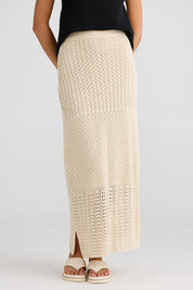 A model wearing the Kasbah Skirt in colour Natural, from the front, cropped image