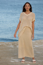A model wearing the Kasbah Skirt in colour Natural, from the front, showing the whole outfit