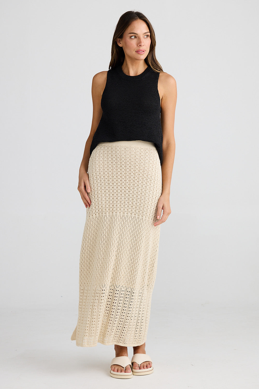 A model wearing the Kasbah Skirt in colour Natural, from the front, showing the whole outfit
