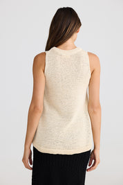 A model wearing the Issa Tank in colour Natural, from the back