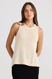 A model wearing the Issa Tank in colour Natural, from the front, cropped image