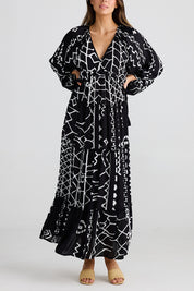 A model wearing the Wing And A Prayer Maxi in colour Blkindus (Black), from the front, cropped image