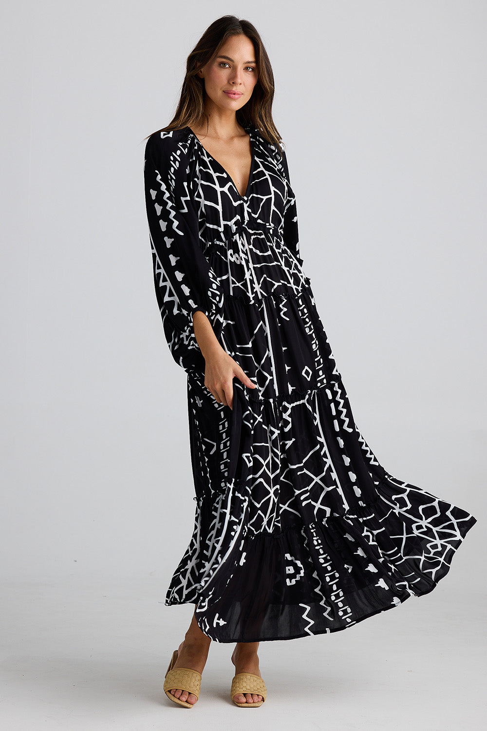 A model wearing the Wing And A Prayer Maxi in colour Blkindus (Black), from the front, showing the whole outfit