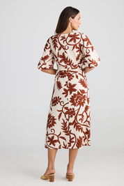A model wearing the Ava Midi Dress in colour Cubanbloom, from the back