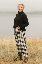 Model Elise wearing size S of the Natalia Skirt in colour Blkwhite (Black), from the front, showing the whole outfit