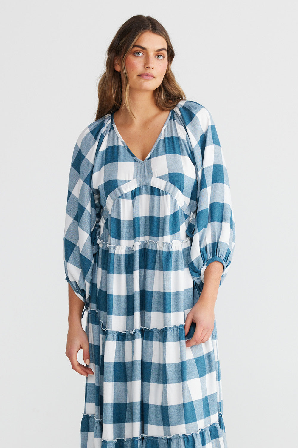 A model wearing the Wing And A Prayer Maxi Dress in colour Bluecheck (Blue), from the front, cropped image