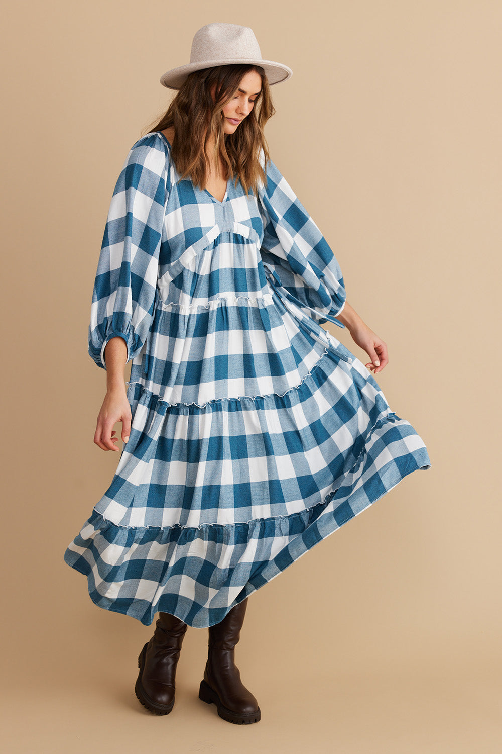 A model wearing the Wing And A Prayer Maxi Dress in colour Bluecheck (Blue), from the front, showing the whole outfit
