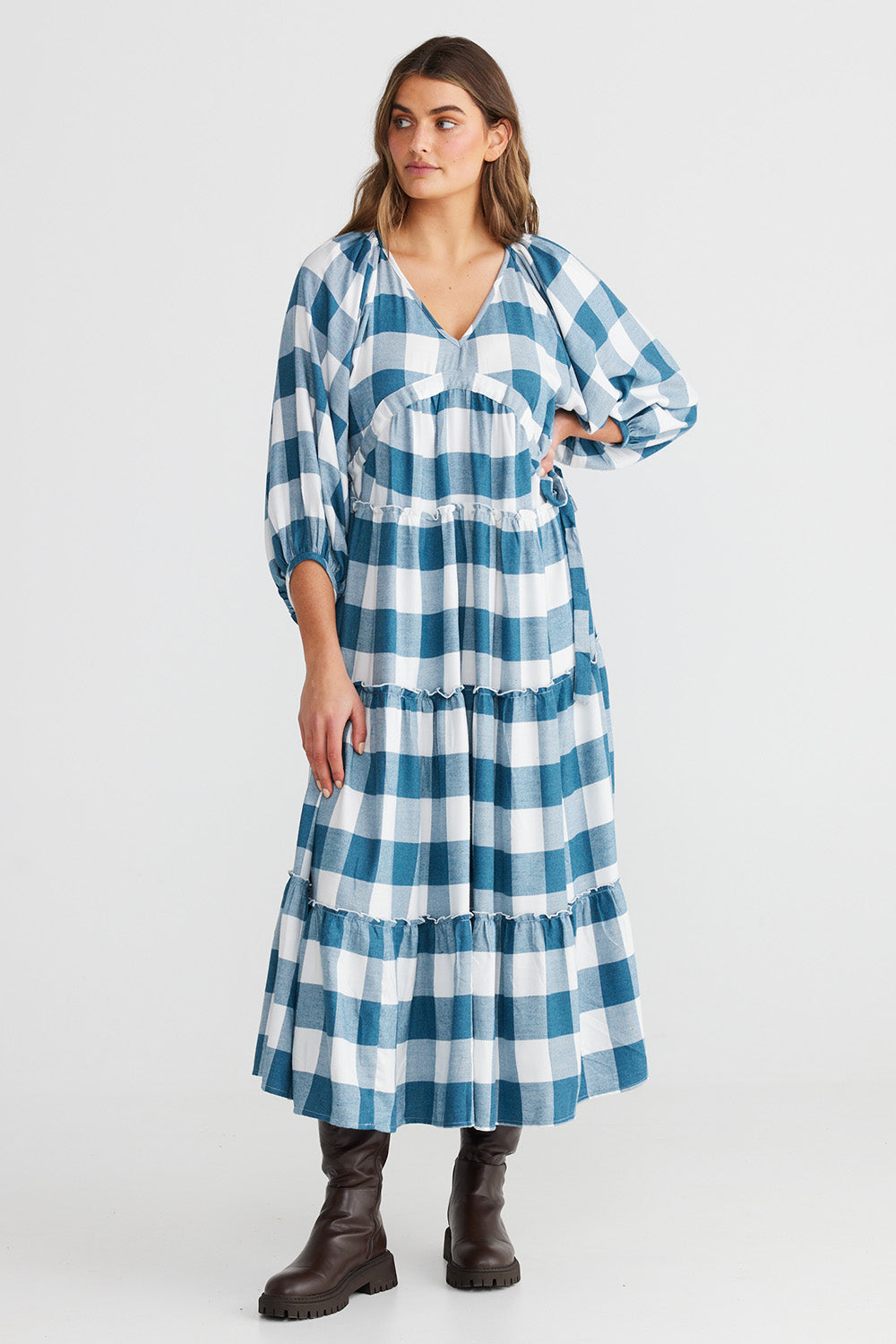 A model wearing the Wing And A Prayer Maxi Dress in colour Bluecheck (Blue), from the front, showing the whole outfit