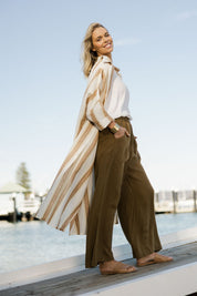 Model Phoebe wearing size OneSize of the Giorgio Coat Dress in colour Fezstripe (White), from the front, showing the whole outfit