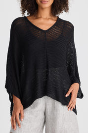 A model wearing the Tesoro Top in colour Black (Black), from the front, cropped image