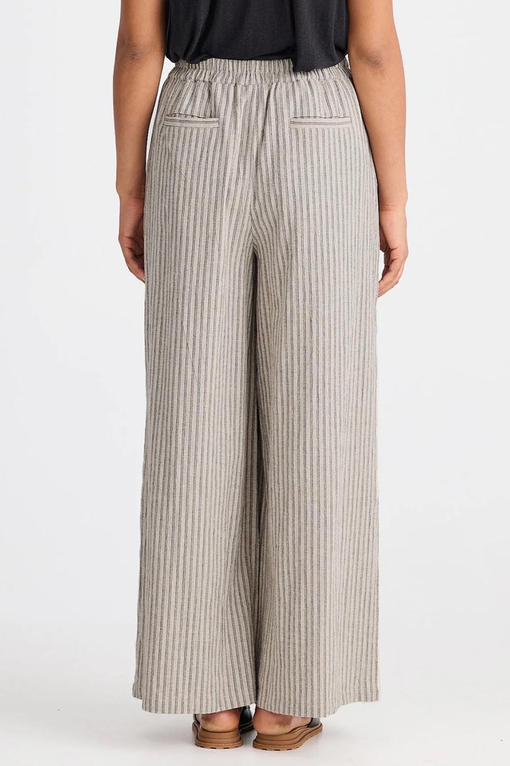 A model wearing the Positano Cotton Linen Pant in colour Pisastripe, from the back