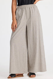 A model wearing the Positano Cotton Linen Pant in colour Pisastripe, from the front, cropped image