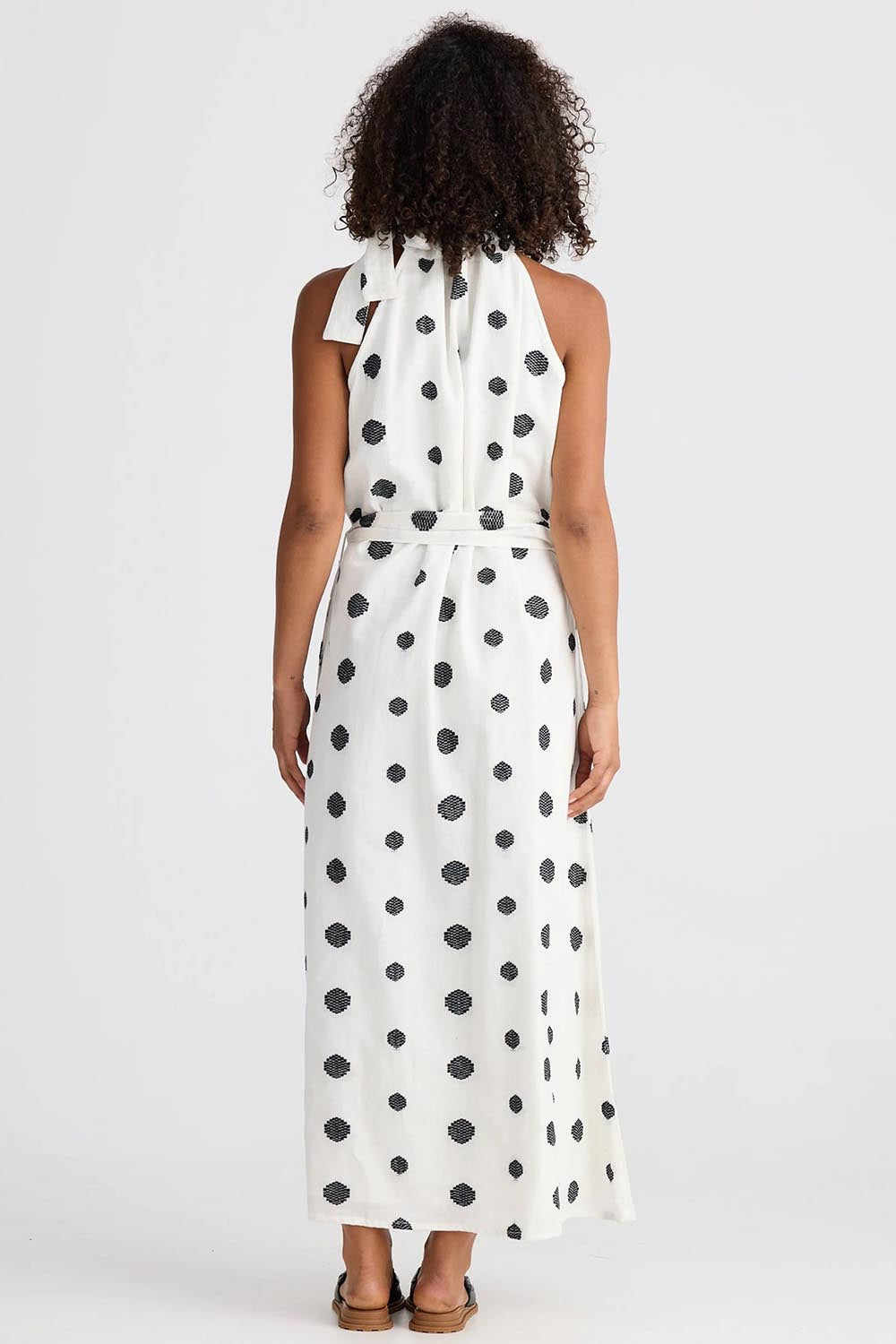 A model wearing the Lucia Linen Cotton Dress in colour Wovenspot (White), from the back