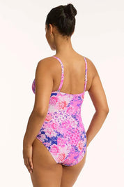 A model wearing the Tie Front Dd/E One Piece in colour Pink (Pink), from the back