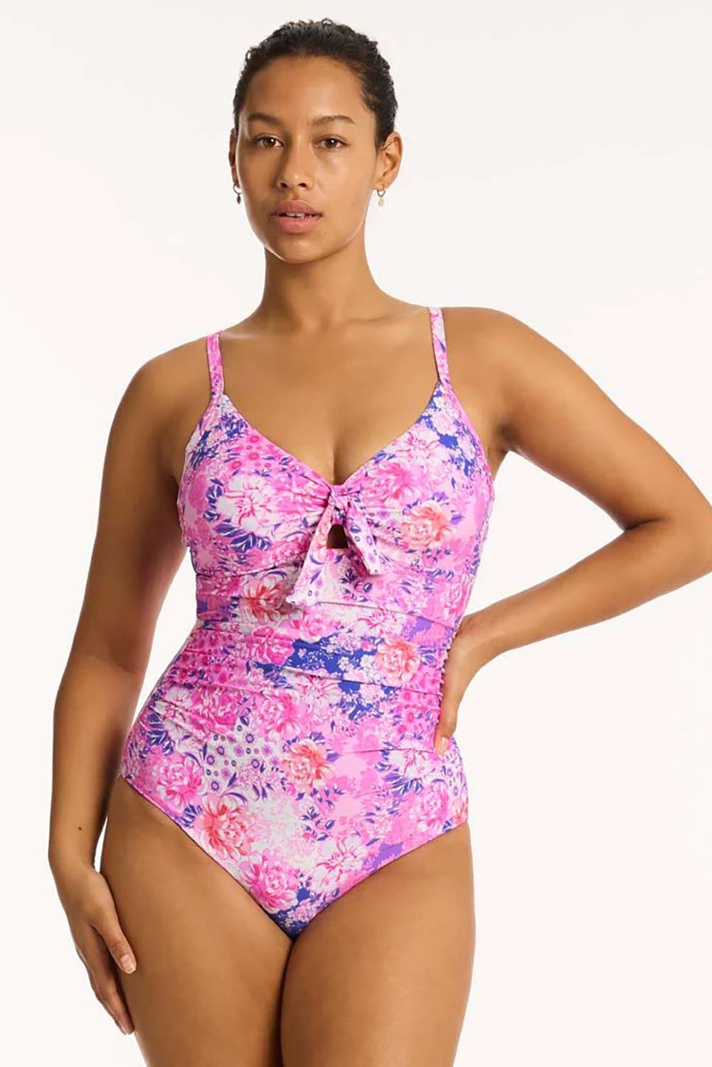 A model wearing the Tie Front Dd/E One Piece in colour Pink (Pink), from the front, cropped image
