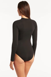 A model wearing the Long Sleeved Multifit One Piece in colour Black (Black), from the back