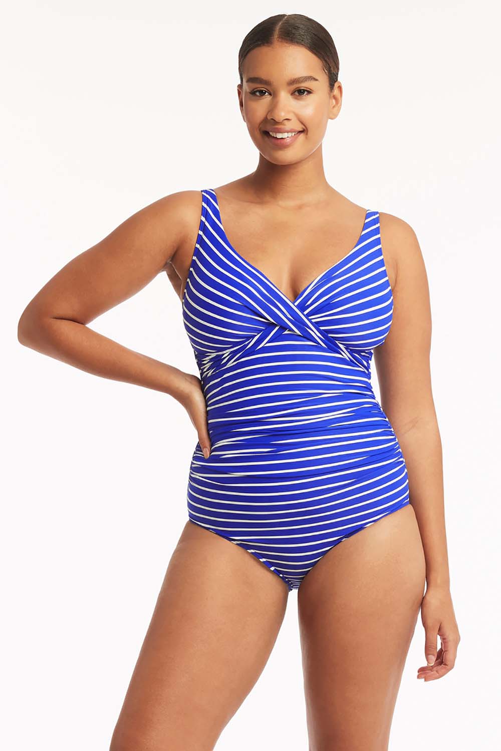 A model wearing the Chamarel Cross Front Multifit One Piece in colour Cobalt (Blue), from the front, cropped image