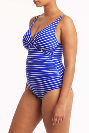 A model wearing the Chamarel Cross Front Multifit One Piece in colour Cobalt (Blue), from the front, cropped image