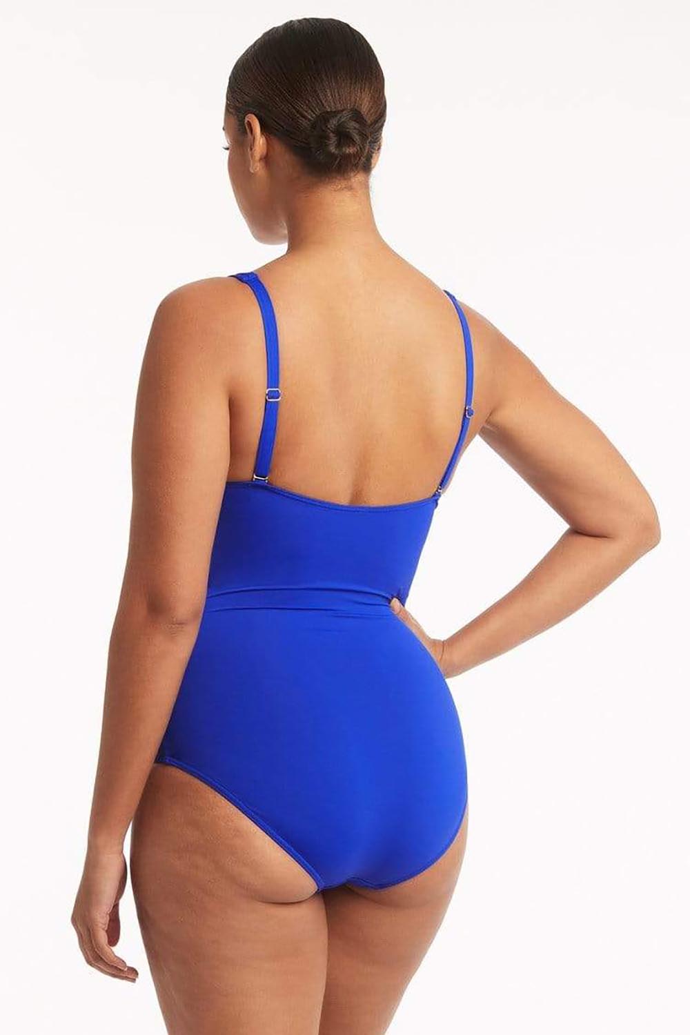A model wearing the Eco Essentials Cross Front One Piece in colour Cobalt (Blue), from the back
