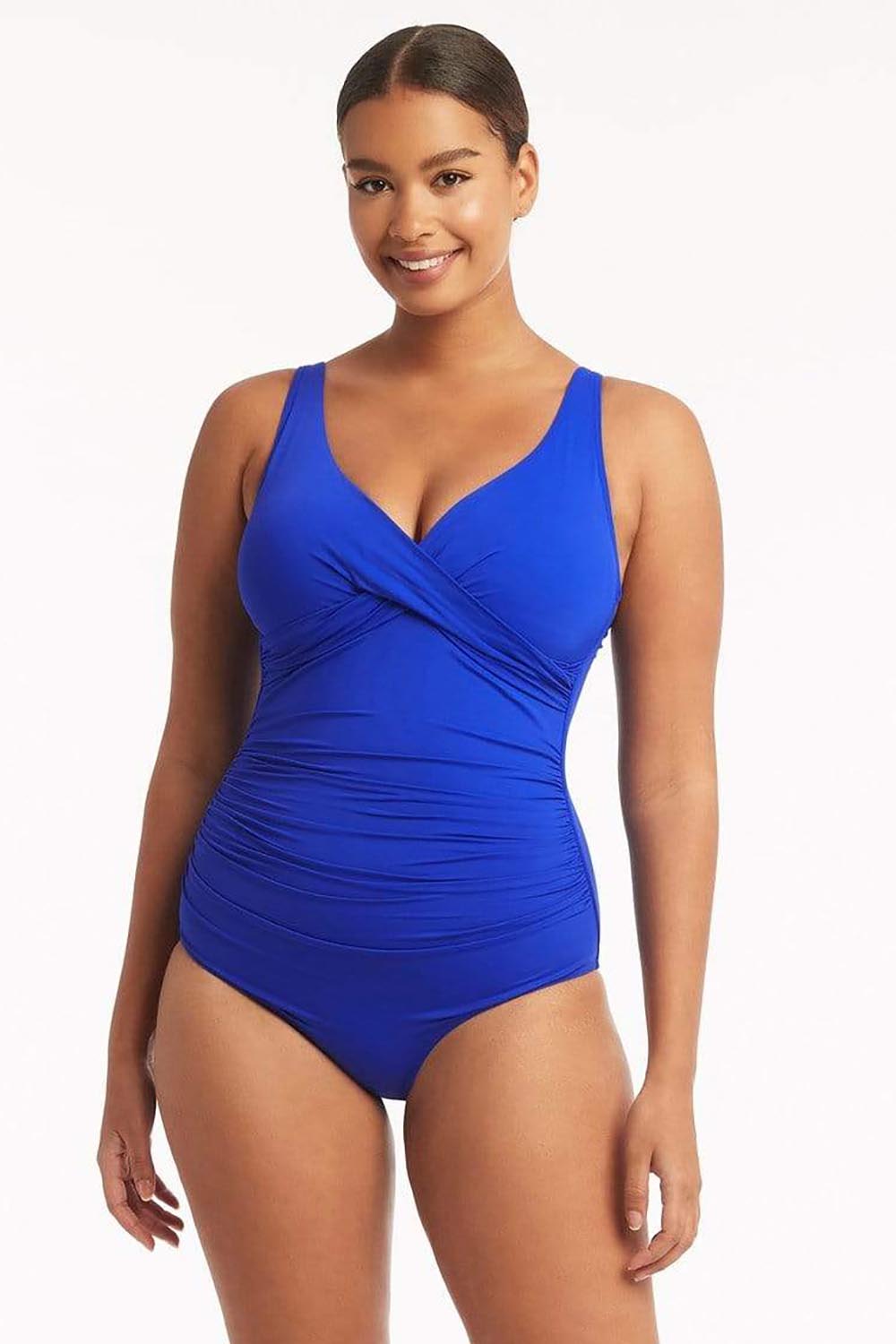 A model wearing the Eco Essentials Cross Front One Piece in colour Cobalt (Blue), from the front, cropped image