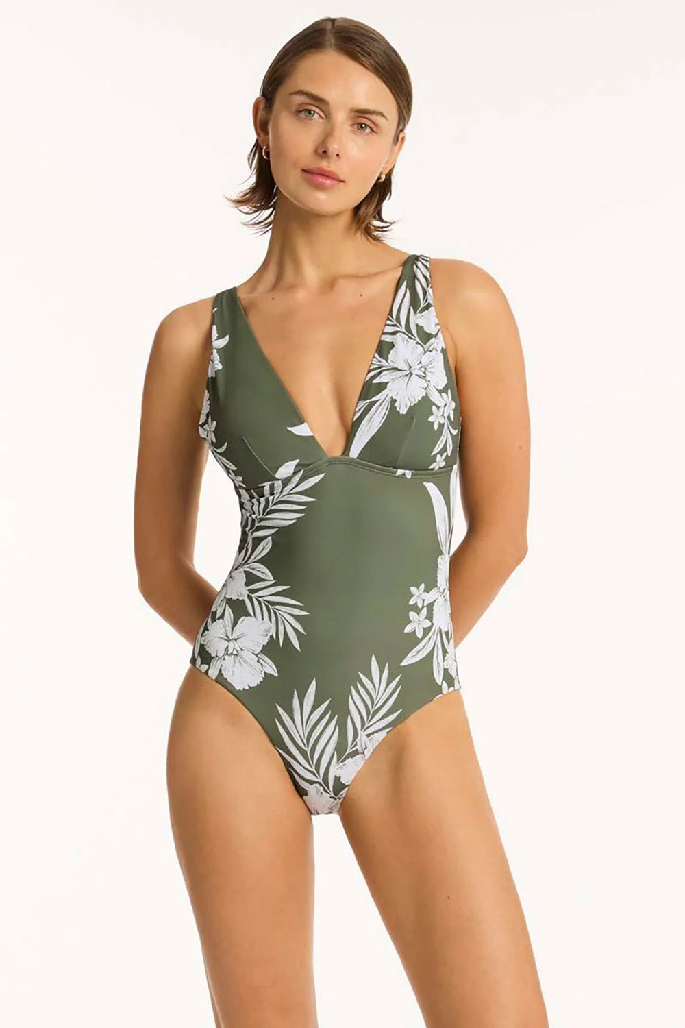 A model wearing the Longline Tri One Piece in colour Khaki (Green), from the front, cropped image