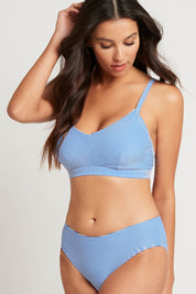 A model wearing the Positano Stripe Cup Bralette in colour Azure (Blue), from the front, cropped image