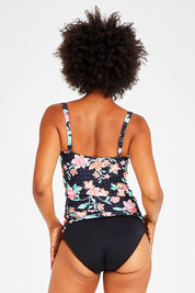 Model Olivia wearing size 10 of the Mauritius Twist Front Multifit Singlet Top in colour Black (Black), from the back