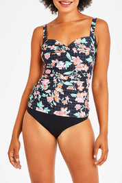 Model Olivia wearing size 10 of the Mauritius Twist Front Multifit Singlet Top in colour Black (Black), from the front, cropped image