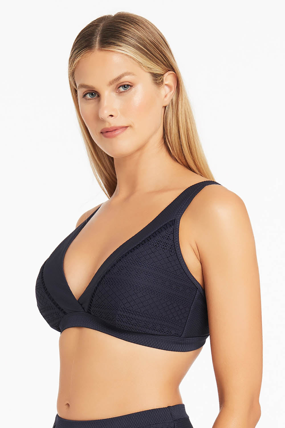 A model wearing the Amazing Lace Cross Front Panelled Bralette in colour Nightsky (Blue), from the front, cropped image