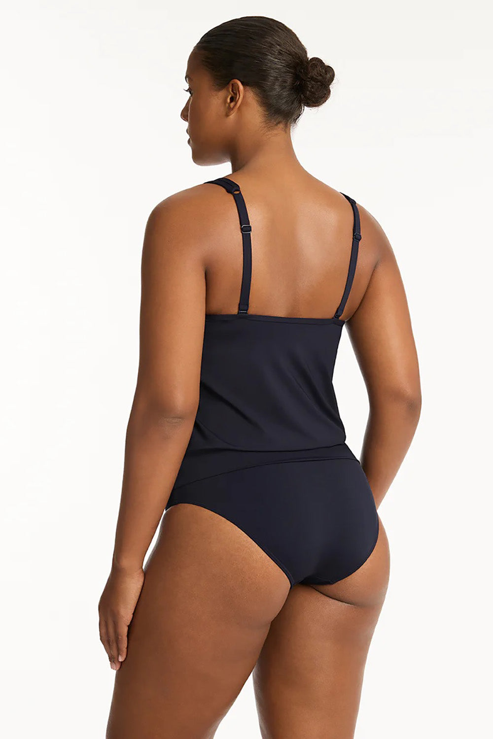 A model wearing the Blouson Tank Multifit Singlet Top in colour Nightsky (Blue), from the back