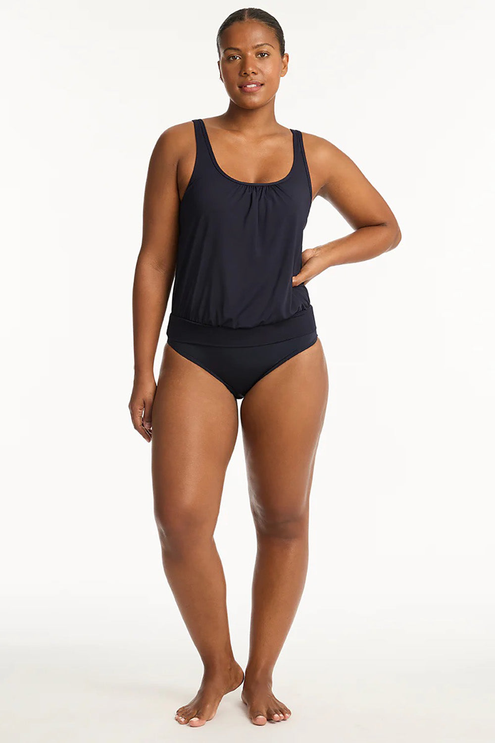 A model wearing the Blouson Tank Multifit Singlet Top in colour Nightsky (Blue), from the front, showing the whole outfit