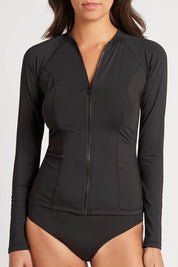 A model wearing the Long Sleeved Rash Vest in colour Black (Black), from the front, cropped image