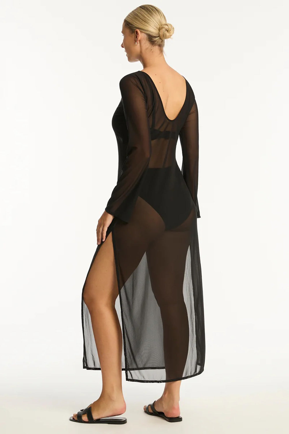 A model wearing the Mesh Reversible Long Dress in colour Black (Black), from the back