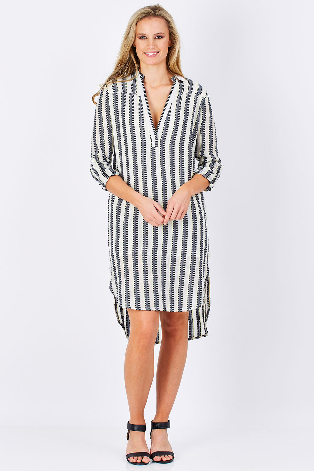 Model Maddy wearing size S of the Andros Dress in colour Stripe (White), from the front, showing the whole outfit