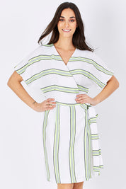 Model Georgia wearing size S of the Dawn Wrap Dress in colour NeonDawn (White), from the front, cropped image