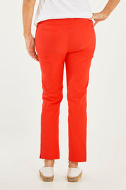 Model Georgia wearing size 10 of the Ankle Pull On Pants With Pockets in colour Tomatored (Red), from the back