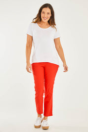Model Georgia wearing size 10 of the Ankle Pull On Pants With Pockets in colour Tomatored (Red), from the front, showing the whole outfit