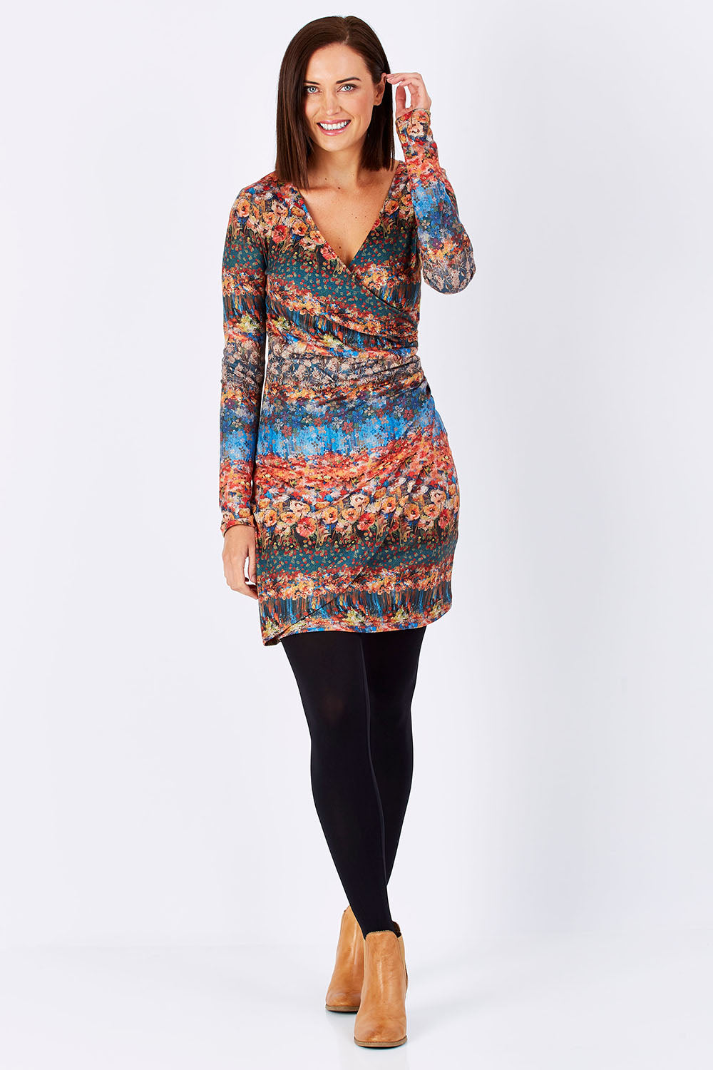 Model Perrie wearing the Avelina Dress in colour Darkorange, from the front, showing the whole outfit