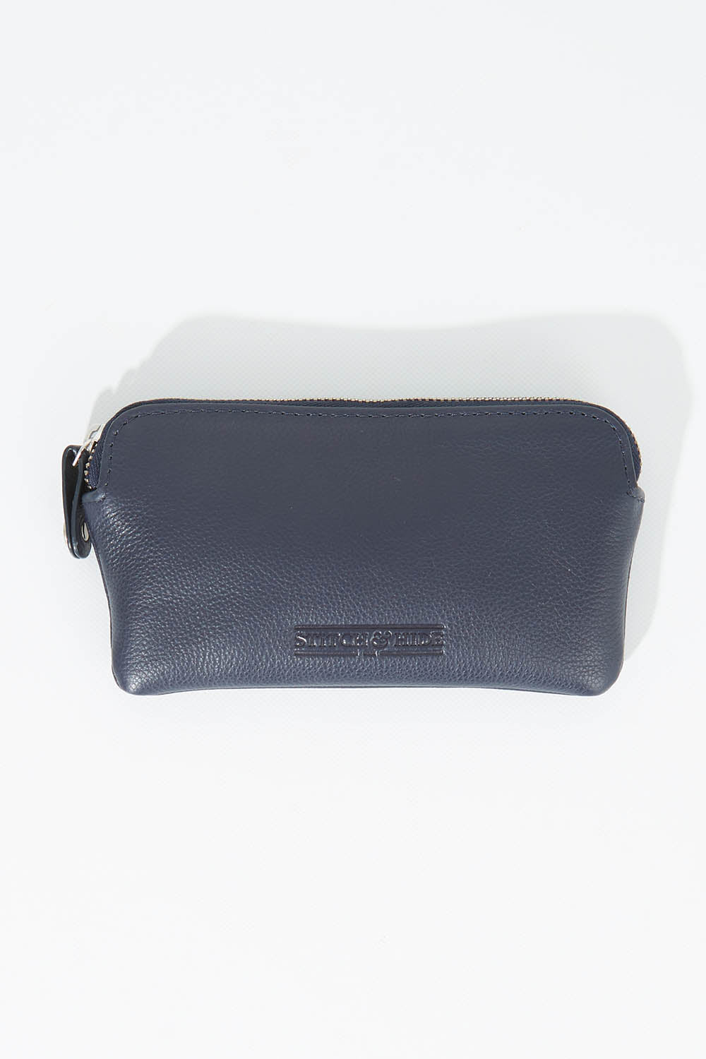 A model wearing size OneSize of the Lucy Leather Coin Pouch in colour Navy (Blue), from the front, showing the whole outfit