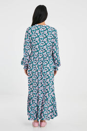 Model Katie wearing size 10 of the Elise Maxi Smock Dress in colour Multi (Blue), from the back
