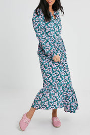 Model Katie wearing size 10 of the Elise Maxi Smock Dress in colour Multi (Blue), from the front, cropped image
