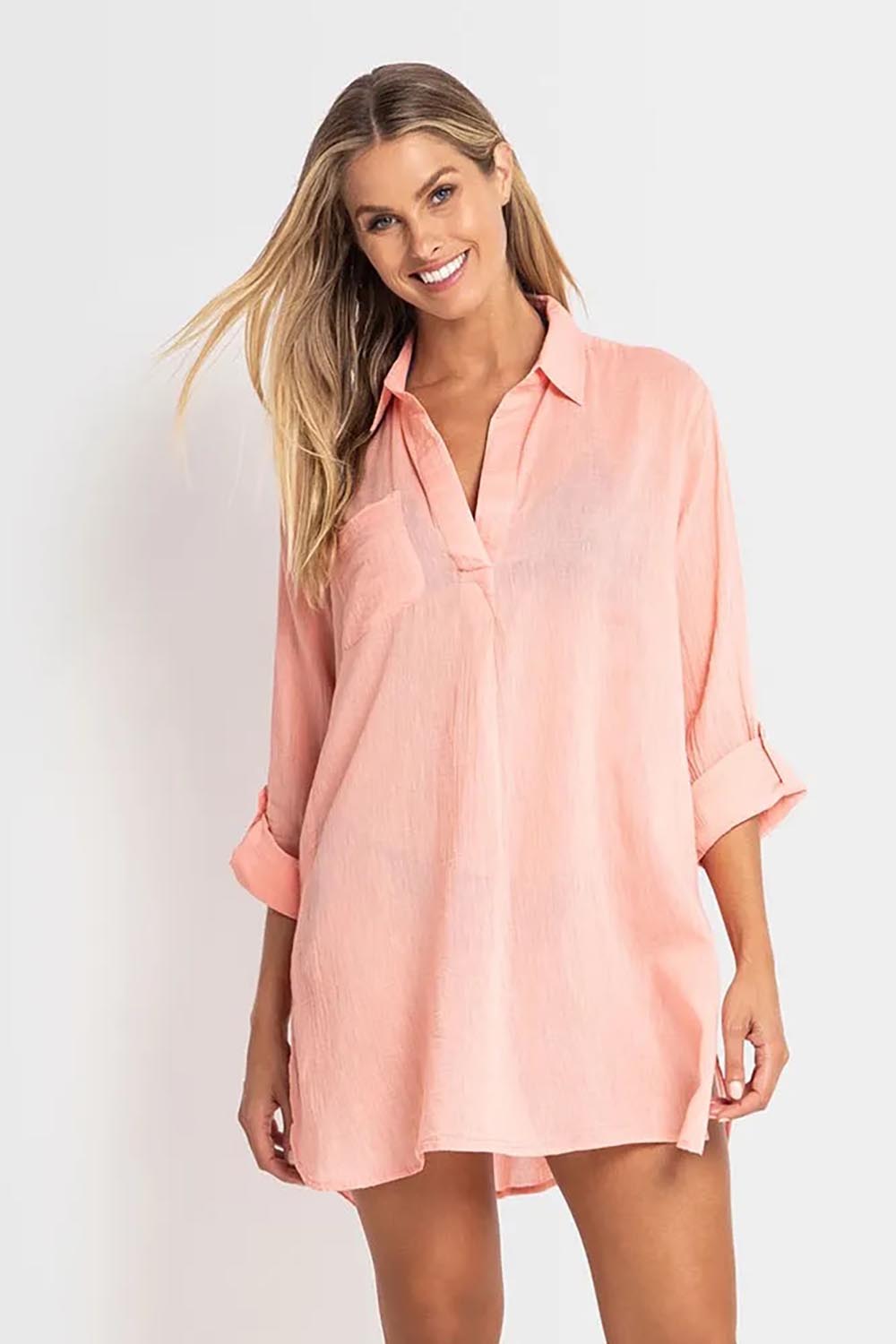 A model wearing the Resort Painters Shirt in colour Coral (Pink), from the front, cropped image