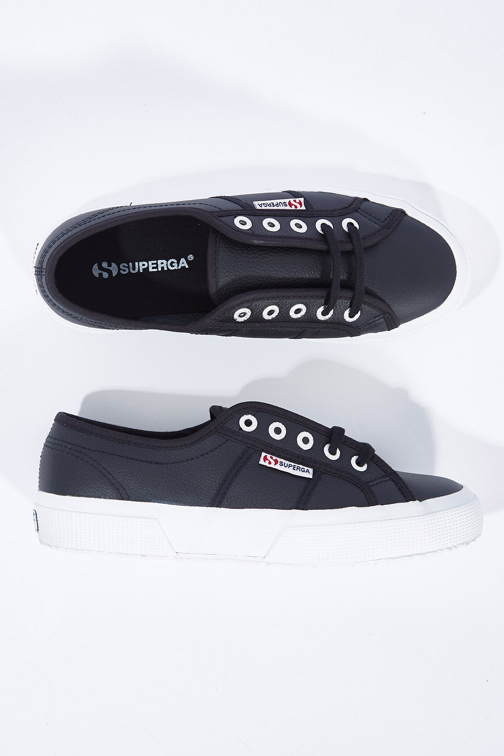 A model wearing size 36 of the Cotu Leather Sneaker in colour BlackWhite (Black), from the front, showing the whole outfit