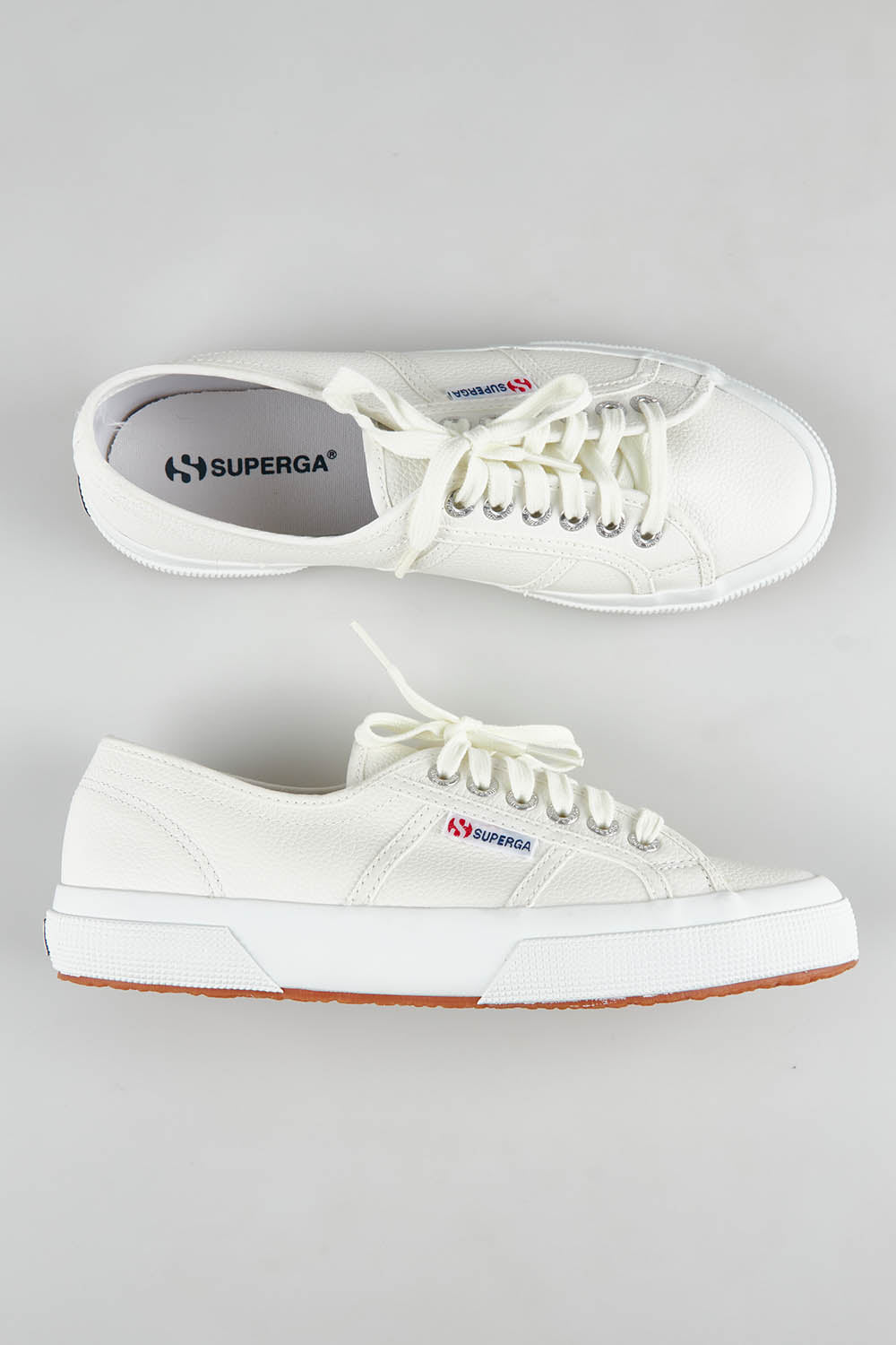 A model wearing size 37 of the Cotu Leather Sneaker in colour White (White), from the front, showing the whole outfit