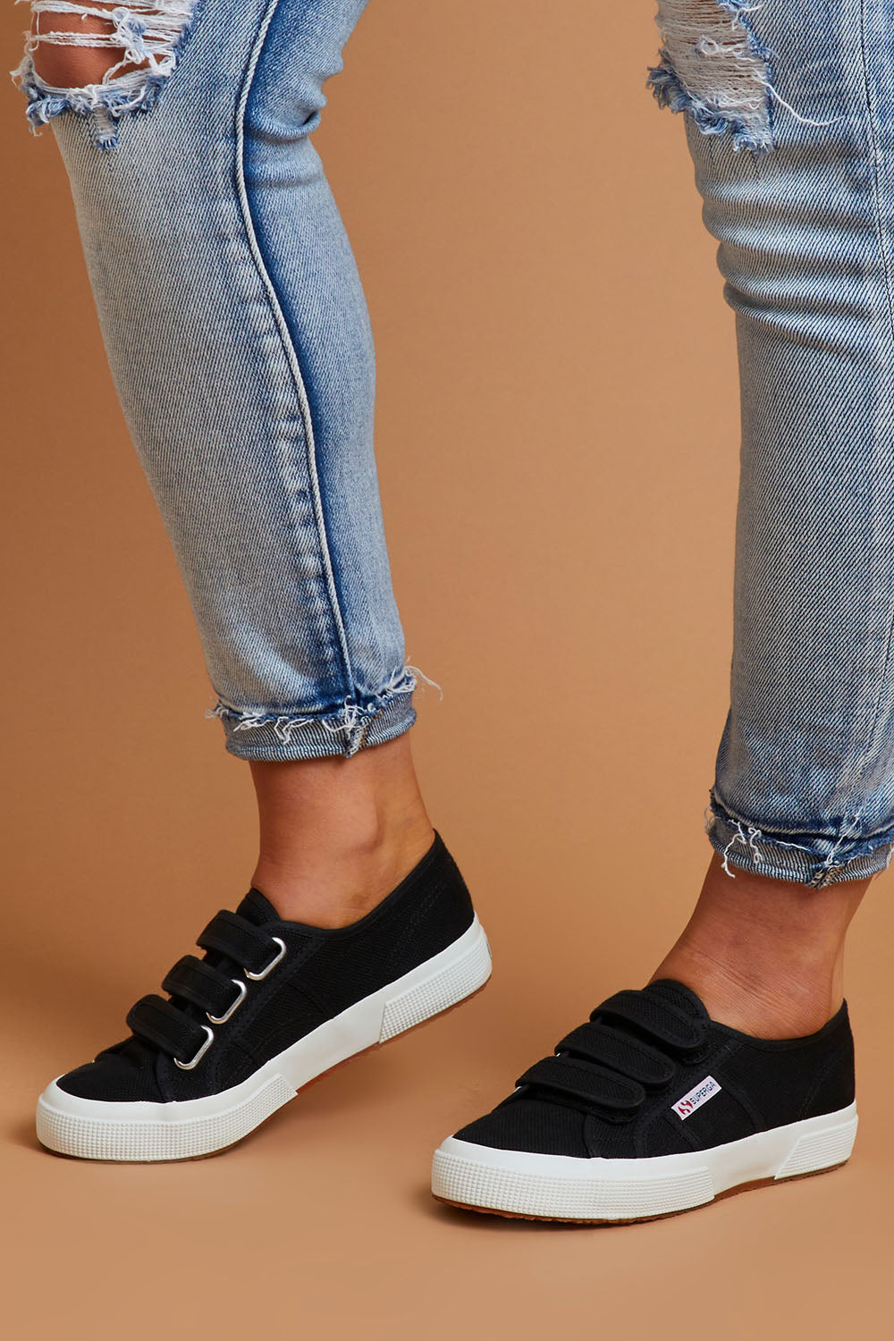 A model wearing size 38 of the 2750 Cotu Straps Sneaker in colour Black (Black), from the front, showing the whole outfit