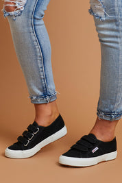 A model wearing size 38 of the 2750 Cotu Straps Sneaker in colour Black (Black), from the front, showing the whole outfit