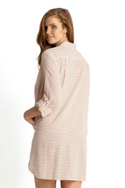 A model wearing the Summer Stripe Painters Shirt in colour Bone, from the back