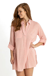 A model wearing the Summer Stripe Painters Shirt in colour Peach (Red), from the front, cropped image